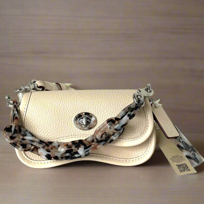 Coach Signature Turnrock mini Pouch