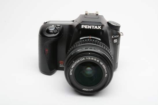 Pentax K100D DSLR w/18-55mm f3.5-5.6 zoom, manuals, book, strap