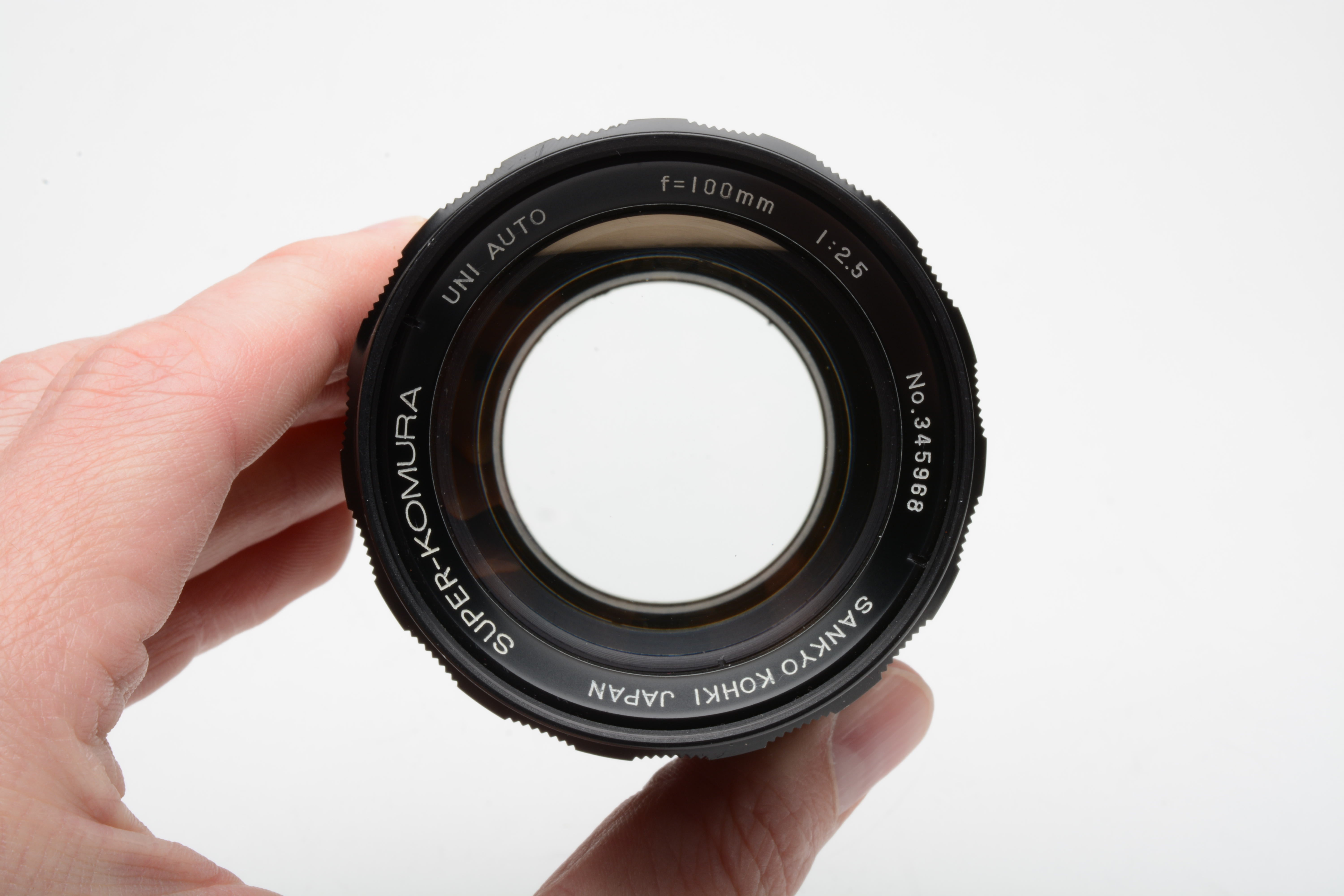 Sankyo Kohki Super Komura 100mm f2.5 lens Nikon F mount, clean