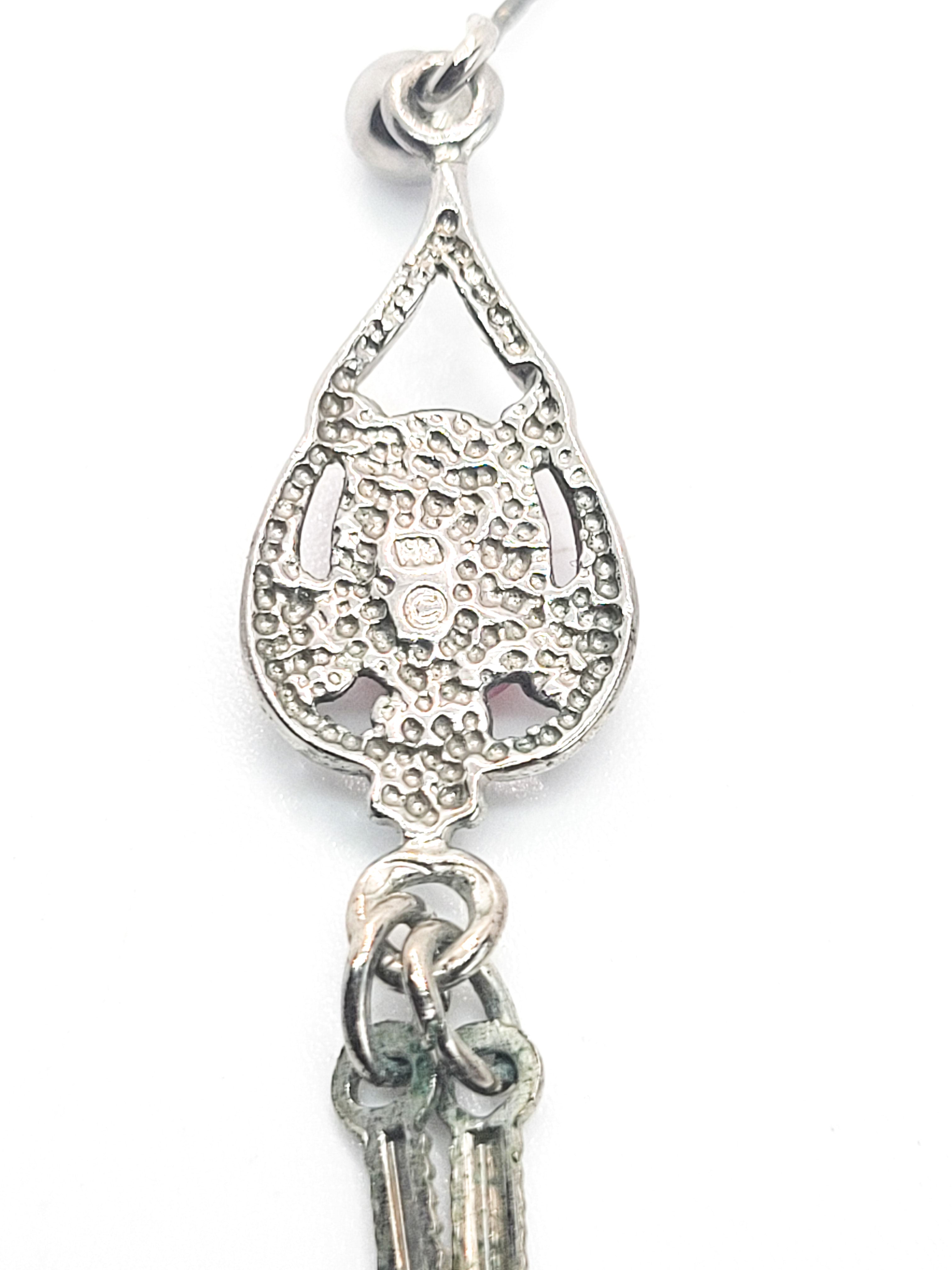 Spiny Oyster Southwestern style sterling silver long drop feather earrings product image view 6